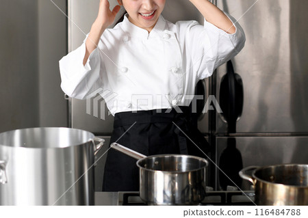 Young chef asian woman having trouble in the kitchen Young chef asian woman having trouble in the kitchen 116484788