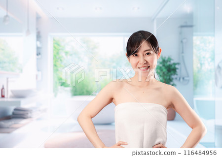 Young woman doing body care in the bathroom 116484956