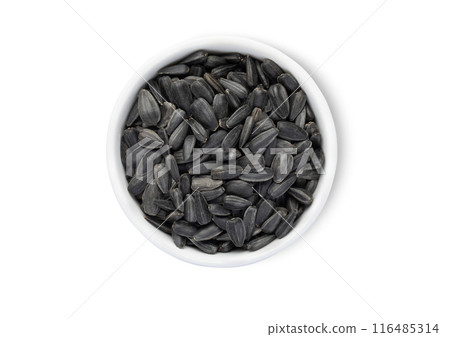 Bowl with healthy black sunflower seeds with shell isolated on white background. Bowl with healthy black sunflower seeds with shell isolated on white background. 116485314