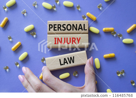Personal Injury Law symbol. Concept words Personal Injury Law on wooden blocks. Beautiful purple background with pills. Doctor hand. Healthcare and Personal Injury Law concept. Copy space. Personal Injury Law symbol. Concept words Personal Injury Law on wooden blocks. Beautiful purple background with pills. Doctor hand. Healthcare and Personal Injury Law concept. Copy space. 116485768
