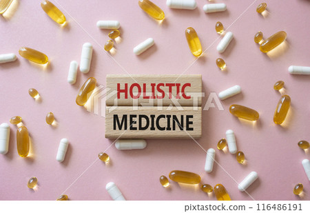Holistic Medicine symbol. Concept word. Holistic Medicine on wooden blocks. Beautiful pink background with pills. Medicine and Holistic Medicine concept. Copy space Holistic Medicine symbol. Concept word. Holistic Medicine on wooden blocks. Beautiful pink background with pills. Medicine and Holistic Medicine concept. Copy space 116486191