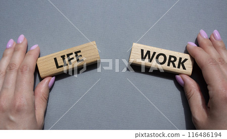 Life or Work symbol. Concept word Life or Work on wooden blocks. Businessman hand. Beautiful grey background. Business and Life or Work concept. Copy space Life or Work symbol. Concept word Life or Work on wooden blocks. Businessman hand. Beautiful grey background. Business and Life or Work concept. Copy space 116486194