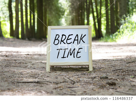 Break Time symbol. Break Time white chalk blackboard. Beautiful forest background. Business and Break Time concept. Copy space. Break Time symbol. Break Time white chalk blackboard. Beautiful forest background. Business and Break Time concept. Copy space. 116486337