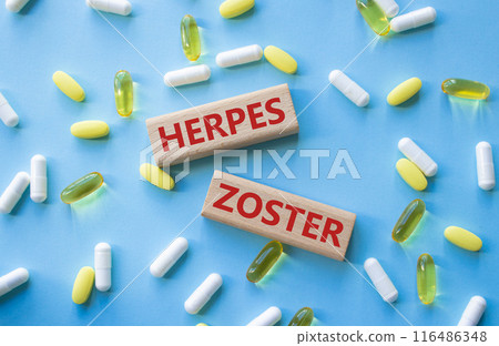 Herpes Zoster symbol. Concept word Herpes Zoster on wooden blocks. Beautiful blue background with pills. Medicine and Herpes Zoster concept. Copy space Herpes Zoster symbol. Concept word Herpes Zoster on wooden blocks. Beautiful blue background with pills. Medicine and Herpes Zoster concept. Copy space 116486348