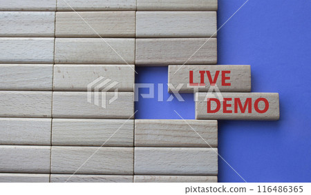 Live Demo symbol. Concept word Live Demo on wooden blocks. Beautiful purple background. Business and Live Demo concept. Copy space 116486365