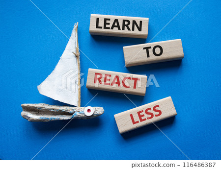 Learn to react Less symbol. Wooden blocks with words Learn to react Less. Beautiful blue background with boat. Business and Learn to react Less. Copy space. 116486387