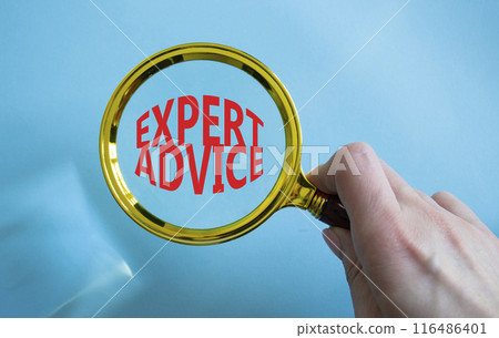Expert advice symbol. Concept word Expert advice on magnifying glass. Businessman hand. Beautiful blue background. Business and Expert advice concept. Copy space 116486401