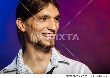 Smiling man with long hairs. 116486627