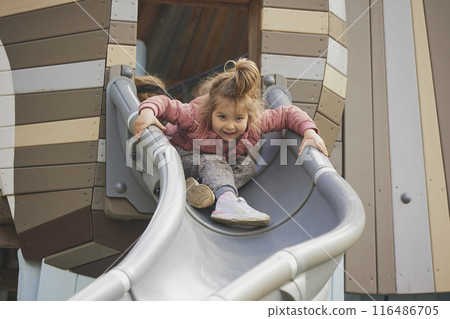 Charming child playing on a playground in Denmark 116486705