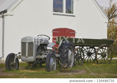Vintage tractor and cart at the ranch in Denmark Vintage tractor and cart at the ranch in Denmark 116486710
