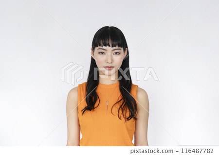 A young woman looking at the camera A young woman looking at the camera 116487782