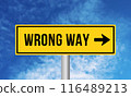 Wrong way road sign on sky background 116489213