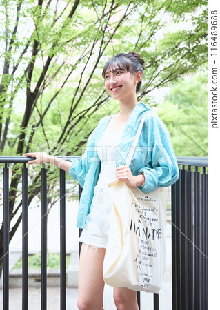 Female college student walking on campus 116489688