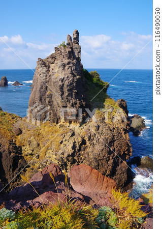Tako stone pillars standing tall at the northern tip of the Shimane Peninsula with the horizon of the Sea of Japan in the background Ver2 116490050