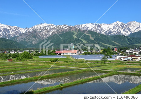 Hakuba Village: Mt. Hakuba and the Ushiro-Tateyama mountain range, reflected in the water as seen from Tenjinzaka near the Highland Hotel 116490060