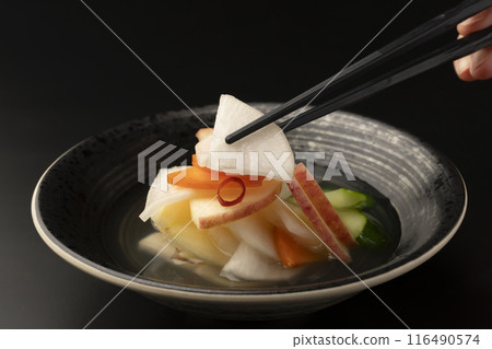Water kimchi with chopsticks 116490574