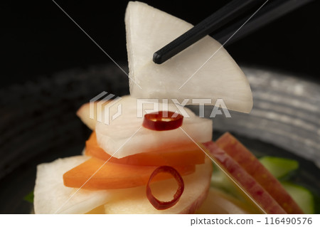 Water kimchi with chopsticks 116490576