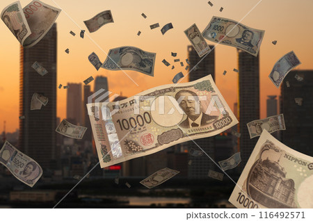A large amount of new banknotes falling from above in the evening light A large amount of new banknotes falling from above in the evening light 116492571