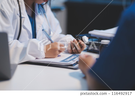 Doctor working in the office and listening to the patient, she is explaining her symptoms, healtcare and assistance concept 116492917