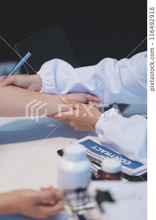 Doctor working in the office and listening to the patient, she is explaining her symptoms, healtcare and assistance concept Doctor working in the office and listening to the patient, she is explaining her symptoms, healtcare and assistance concept 116492918