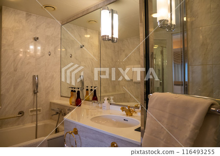 Classic hotel marble bathroom and thick towels 116493255