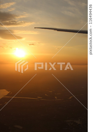 A sunset glow seen from an airplane A sunset glow seen from an airplane 116494436