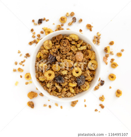 crunchy granola in bowl isolated on white background crunchy granola in bowl isolated on white background 116495107