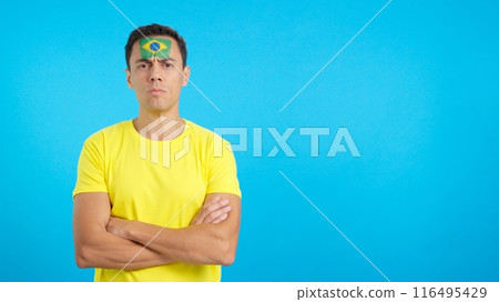 Dignified and serious man with brazilian flag painted on face 116495429