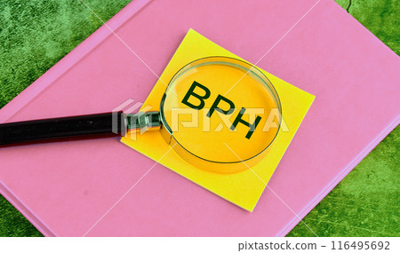 BPH Benign Prostatic Hyperplasia. BPH written through a magnifying glass on a yellow sticker, a concept photo 116495692