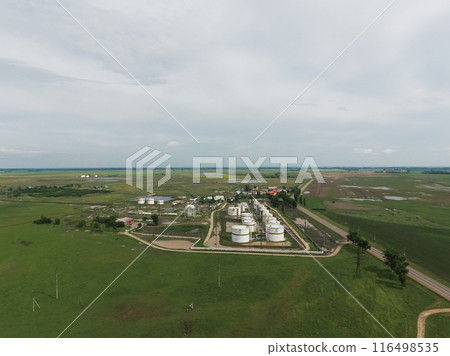 Aerial view of oil storage tanks 116498535