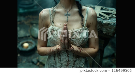 woman in a white dress kneels in prayer with a cross on her forehead, embodying grace, devotion, and spirituality. 116499505