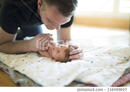 Father looking at his newborn baby. Unconditional paternal love, Father's Day concept. Father looking at his newborn baby. Unconditional paternal love, Father's Day concept. 116499607