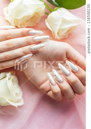 Female Hands with beautiful pearl manicure Female Hands with beautiful pearl manicure 116500230