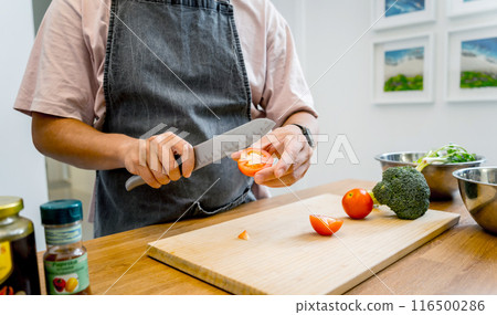 Chef at the kitchen preparing tofu scramble with vegetables Chef at the kitchen preparing tofu scramble with vegetables 116500286