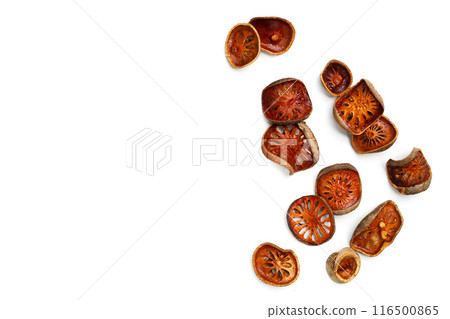 Dried bael fruit slices on white background. 116500865