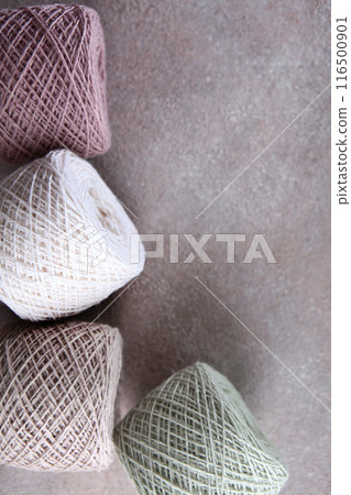 Set of colored cotton yarn. Multicolored balls of yarn for knitting. Handmade work. The concept of a hobby. Skeins of yarn for knitting as a background. Vertical photo. Set of colored cotton yarn. Multicolored balls of yarn for knitting. Handmade work. The concept of a hobby. Skeins of yarn for knitting as a background. Vertical photo. 116500901