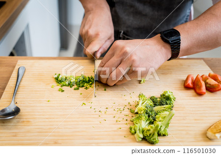 Chef at the kitchen preparing healthy quinoa bowl with avocado Chef at the kitchen preparing healthy quinoa bowl with avocado 116501030
