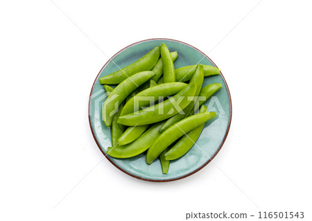 Fresh young green peas on white background. Fresh young green peas on white background. 116501543