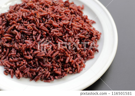 Cooked black rice on dark background. Cooked black rice on dark background. 116501581