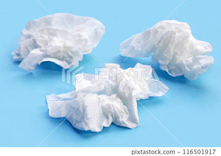 Crumpled tissue paper. Facial tissue on blue background. 116501917