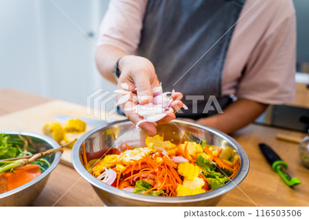 Chef at the kitchen preparing spicy glass noodle salad Chef at the kitchen preparing spicy glass noodle salad 116503506