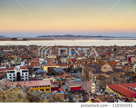 View of lake Titicaca at sunset from Huajsapata Hill viewpoint, Puno, Peru 116504291