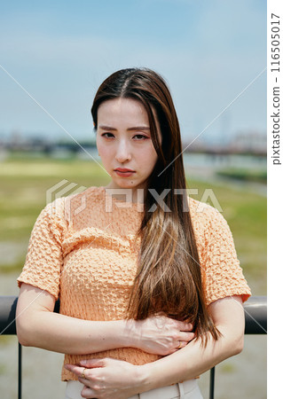 Young woman with angry expression on a bridge 116505017