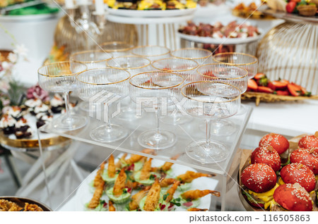 A wide variety of snacks on the table for guests. Shrimp, boiled pork, various types of meat and other products A wide variety of snacks on the table for guests. Shrimp, boiled pork, various types of meat and other products 116505863