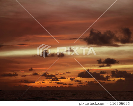 Beautiful sunset on the ocean shore with a view of the islands 116506635