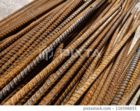 A rusty metal bars is stacked at the construction site A rusty metal bars is stacked at the construction site 116506655