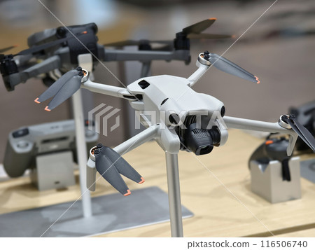 Modern drone for video and photo in the light store Modern drone for video and photo in the light store 116506740