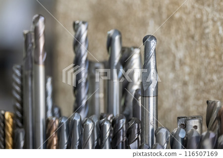Close-up scene group of the used solid end mill tools. Close-up scene group of the used solid end mill tools. 116507169