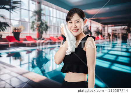 Young woman having fun in the pool Young woman having fun in the pool 116507744