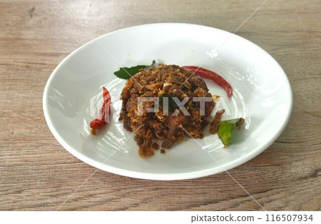 spicy fried chop fermenting fish with herb and chili on plate 116507934